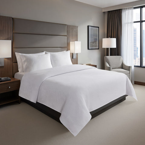 How to Extend the Life of Coverlets and Bed Scarves Under Commercial Laundering